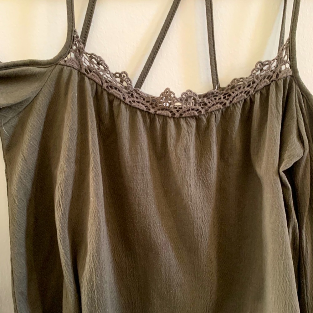 Cute top with unique collar/shoulder design.